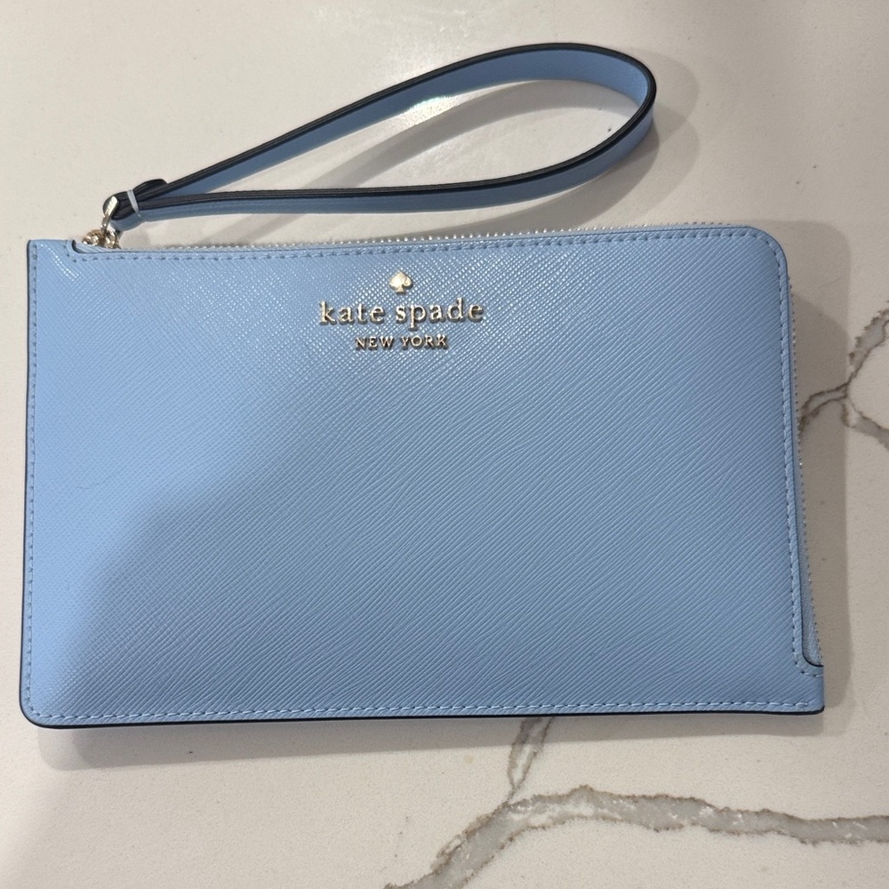 Kate Spade light blue leather wristlet with gold logo